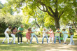 © GAJENDRRA BHATI  - Group Of Senior Indian People Playing Tug War Outdoor In Park. Retirement life.