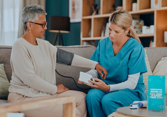 Canvas Print - Test, consultation and doctor with a patient for blood pressure exam, healthcare and care in nursing home on the sofa. Medical, support and senior woman with a nursing caregiver with check on health