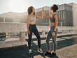 © N F/peopleimages.com - Fitness, friends and high five in the city for workout, exercise or healthy training together in the outdoors. Happy women touching hands in partnership for sports wellness, exercising or run in town