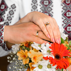 Wall Mural - Wedding ceremony, young couple exchange wedding rings on the wedding day.