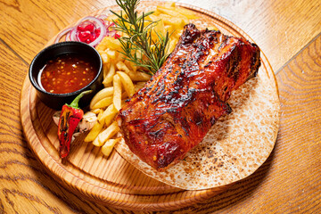 Canvas Print - grilled ribs with french fries and sauce