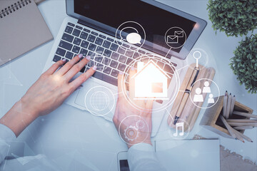 Poster - Double exposure of woman hands working on computer and buildings construction hologram drawing. Top View. smart city concept.