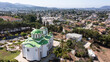 Afternoon aerial view of a church and suburban neighborhood in San Marcos, California, USA.