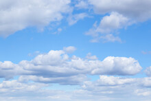 Picturesque View Of Beautiful Fluffy Clouds In Light Blue Sky