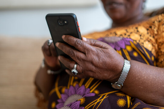 Close-up of senior woman's hands holding smart phone