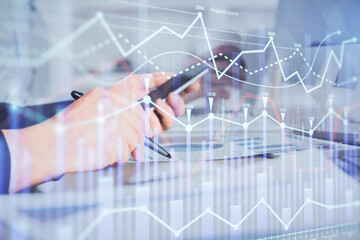 Poster - Double exposure of man's hands holding and using a phone and financial chart drawing. Market analysis concept.