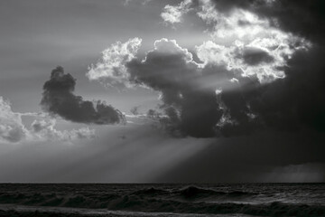 Poster - Cloudy sky with sunbeams