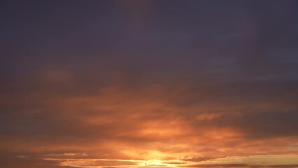Wall Mural - beautiful early morning blue sky with golden clouds. 4k video time lapse of amazing peaceful sunny c