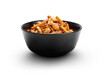 A black ceramic bowl of crispy savoury cracker party food snacks isolated against a transparent background.
