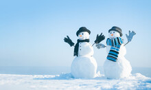 Snowman Holding Hands Outdoors. Winter Snowman In Black Hat, Scarf And Gloves. Christmas Winter Banner With Snowman. Winter Greeting Card With With Snowman.