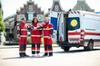 © zinkevych - Ambulance staff demonstrating their team spirit before the camera