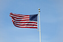 Low Angle View Of American Flag Against Clear Sky