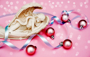 Wall Mural - beautiful angel archangel with christmas pink balls and blue ribbon and with snowflakes with copy sp