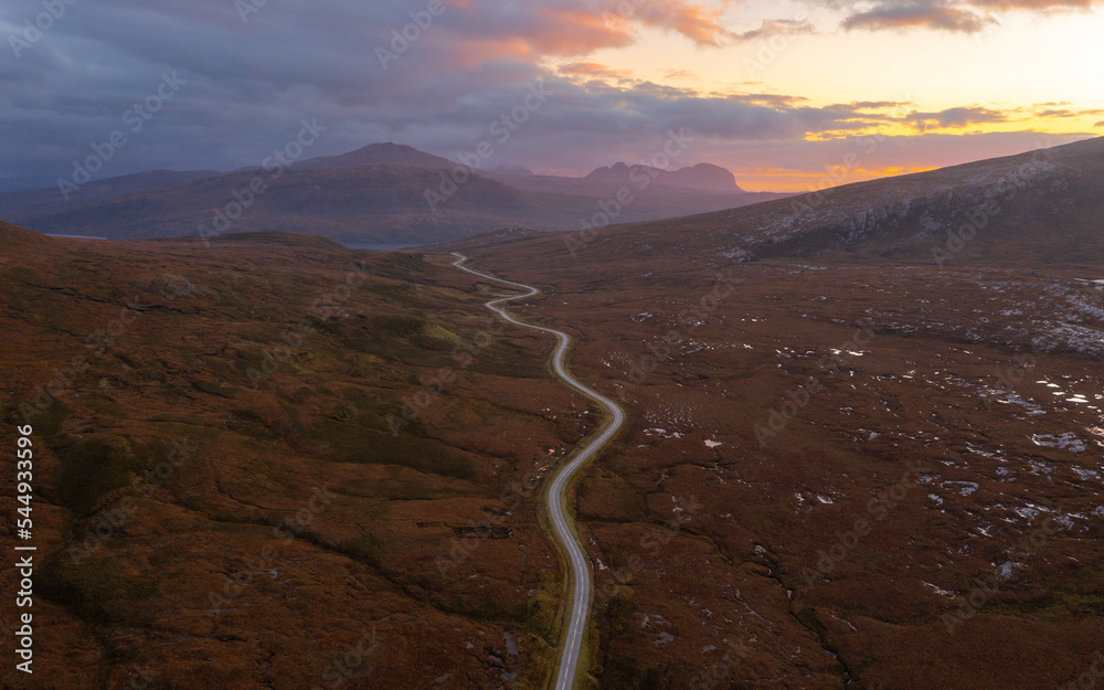 Winding roads and a Scottish Road Trip through the Highlands at sunset ...