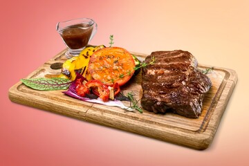 Poster - Tasty meat dish with vegetables on wooden board