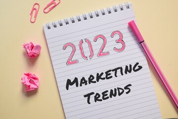 2023 Marketing trends concept on notepad on desk. 