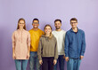 © Studio Romantic - Group portrait of smiling multiethnic young people pose on violet studio background show unity and leadership. Happy diverse multiracial students or colleagues for team picture.