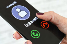 Hand Holding Cellphone With Incoming Call From Unknown Caller - Fraud Scam Phishing