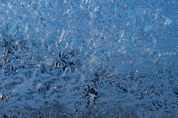 Poster - Frosty winter background photo of ice buildup on a window.