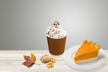 Wall Mural - Tasty aroma latte in glass with leaves and cake