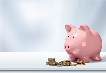 Wall Mural - Classic ceramic piggy bank with coins on desk