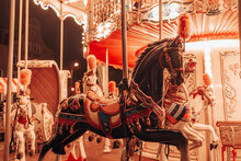  Three Horses And A Plane On A Traditional Fair Carousel. Carousel With Horses In Gdansk, Poland, Europe. 