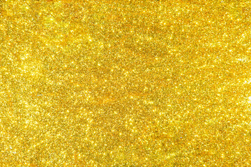Poster - Abstract golden texture in blurry light for background. Glitter pattern for photo effect and wallpaper