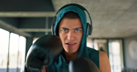 Poster - Sports, fitness and portrait of man boxing with headphones on for practice in gym. Exercise, workout and male athlete with boxing gloves for kickboxing training, listening to music, track and audio