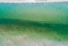Aerial View Of Sand Ripples And Patterns In A Shallow Creek.