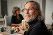 © Johnér - Portrait of senior man having dinner with family