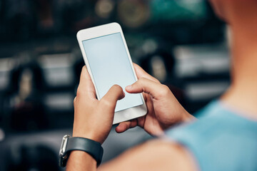 Canvas Print - Smartphone, screen mockup and man hands with fitness communication, social media update or website information on mobile app. Gym, training and sports person typing health progress on a cellphone