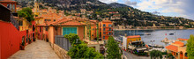 Seaside Panorama With Colorful Houses And Boats On The Mediterranean Sea In Villefranche Sur Mer Old Town On The French Riviera, South Of France
