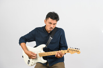 Wall Mural - Portrait of Young Asian man in blue shirt with electronic guitar isolated on white background