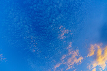 background from glowing clouds in a dark blue evening sky