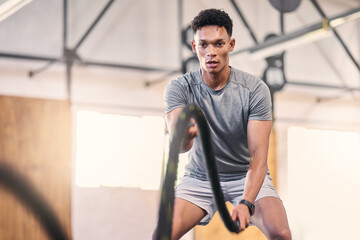 Poster - Gym battle ropes, training and black man athlete in a cardio, workout and sports exercise. Man in a wellness rope and health club with power, energy and strong muscle doing fitness and trainer lift