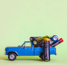 Used Batteries From Different Manufacturers On A Children's Car Toy Pickup, Waste, Collection And Recycling, High Environmental Hazard, Selective Focus