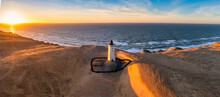 Rubjerg Knude Fyr Lighthouse In Sunset From Drone