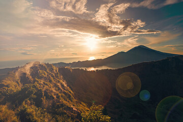 Breathtaking sunrise over Abang mountain, view from Batur volcano and Batur lake, Bali, Indonesia