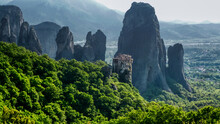 Panoramic View Of Old Monastery Against Rock Formations