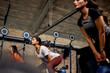 © Flamingo Images - Women doing a gym kettlebell class together