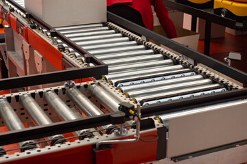 Poster - Empty conveyor fragment. Production line at modern plant. Assembly line in production hangar. Industrial conveyor with metal rollers. Concept maintenance and repair production lines. Plants conveyor.
