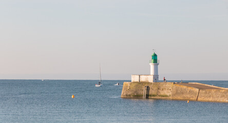 Wall Mural - la petite jetée et le phare vert à l'entrée du port des Sables d'Olonne en Vendée en France en été