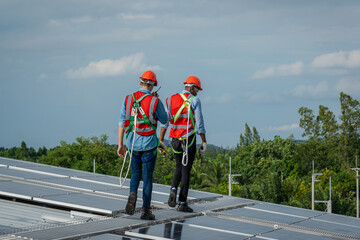 Aufkleber - Engineer or worker installing a solar cell on the roof in warehouse factory,Eco technology for electric power.