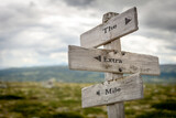 Fototapeta  - the extra mile text quote written on wooden signpost outdoors in nature.
