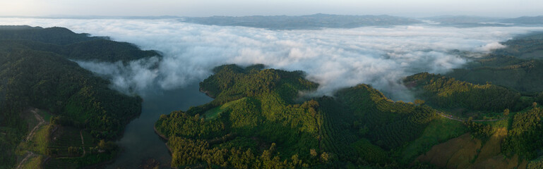 Wall Mural - Panoramic Landscape at morning mist heavy over reservoir or dam in national park, north of thailand aerial view