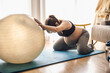 © ikostudio - Pegnant woman doing exercise at home