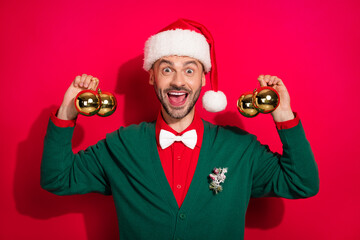 Poster - Photo of sweet impressed guy dressed xmas green cardigan bowtie ready decorate christmas tree isolated red color background