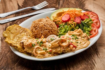 Sticker - Plate with Pariser schnitzel, rice, and vegetables on a wooden table