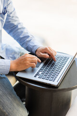 Wall Mural - Image of male hands typing on keyboard, selective focus.