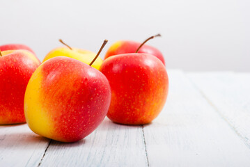 Wall Mural - apple fruits on old white wooden table